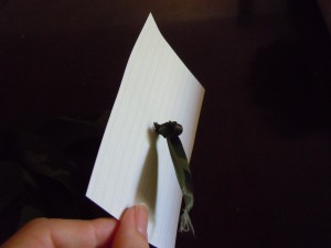 Ribbon knotted through index card
